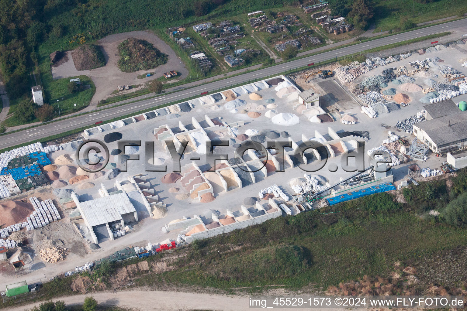 Garden gravel company, Badische Terrazzo Handelsgesellschaft mbH Huttenheimer Landstrasse 2-6 in the district Neudorf in Graben-Neudorf in the state Baden-Wuerttemberg, Germany from a drone