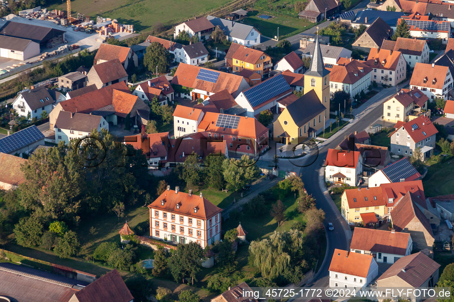 Aerial view of Buildings and parks at the mansion of the farmhouse in Sambach in the state Bavaria, Germany