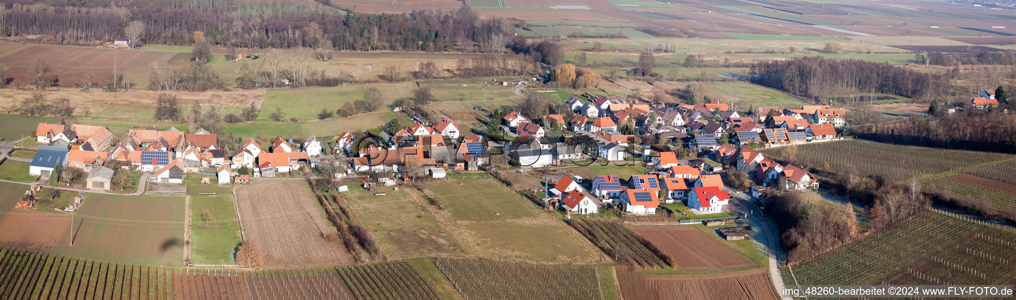 Panoranmic perspective Village - view on the edge of agricultural fields and farmland in Hergersweiler in the state Rhineland-Palatinate, Germany