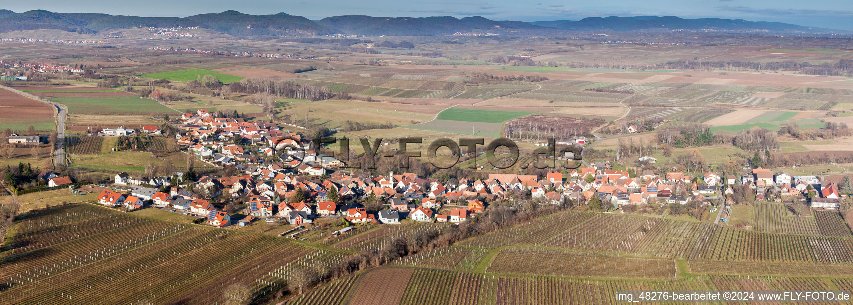 Panoramic perspective Village - view on the edge of agricultural fields and farmland in Oberhausen in the state Rhineland-Palatinate, Germany