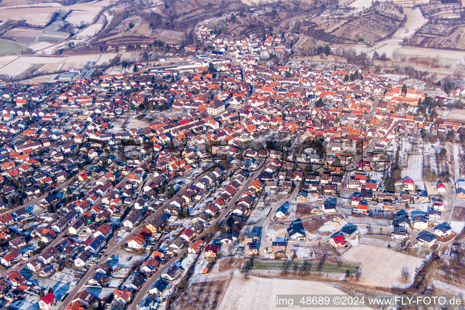 Wintry snowy Town View of the streets and houses of the residential areas in Unteroewisheim in the state Baden-Wurttemberg, Germany