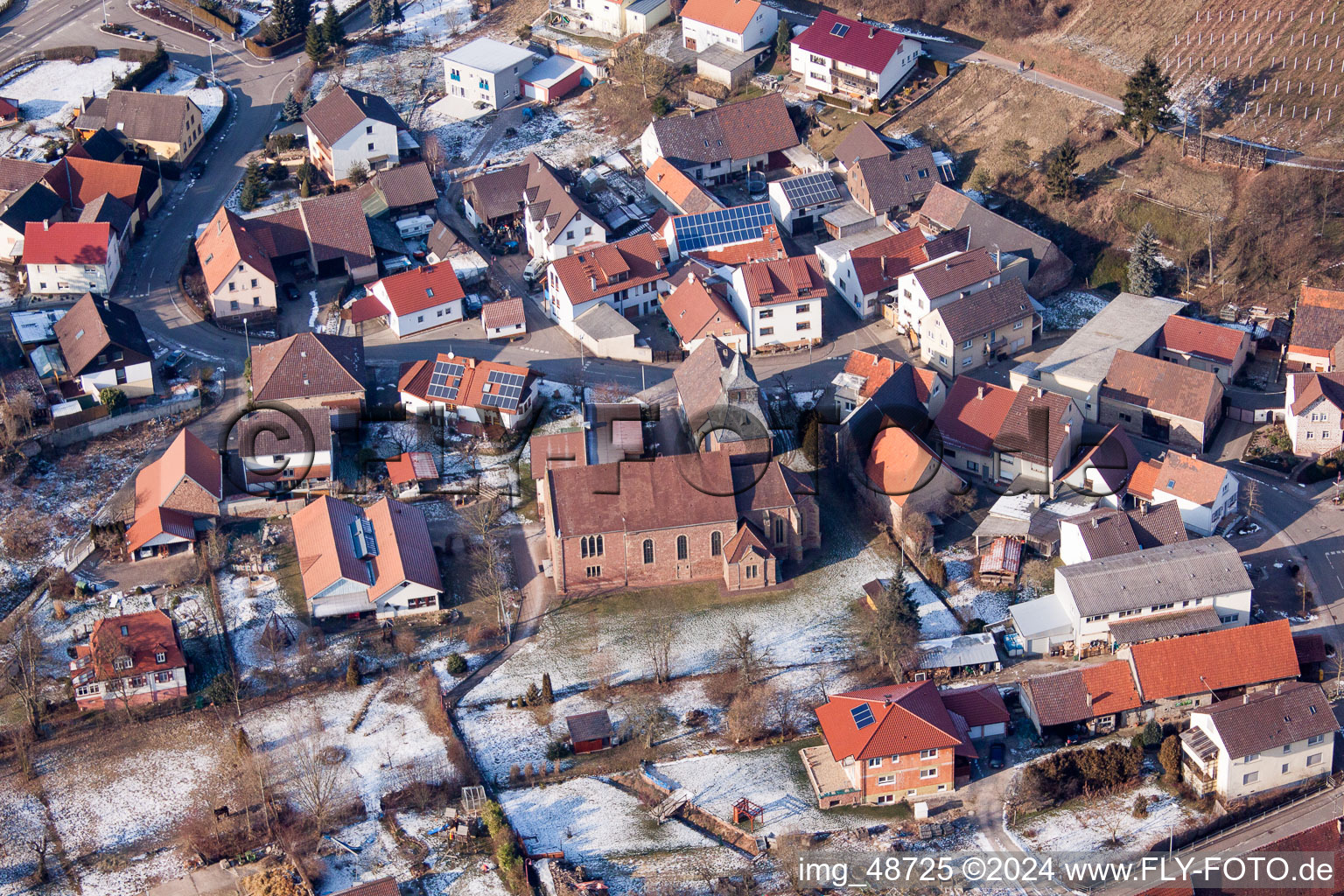 Wintry snowy Church building in the village of in the district Neuenburg in Kraichtal in the state Baden-Wurttemberg, Germany