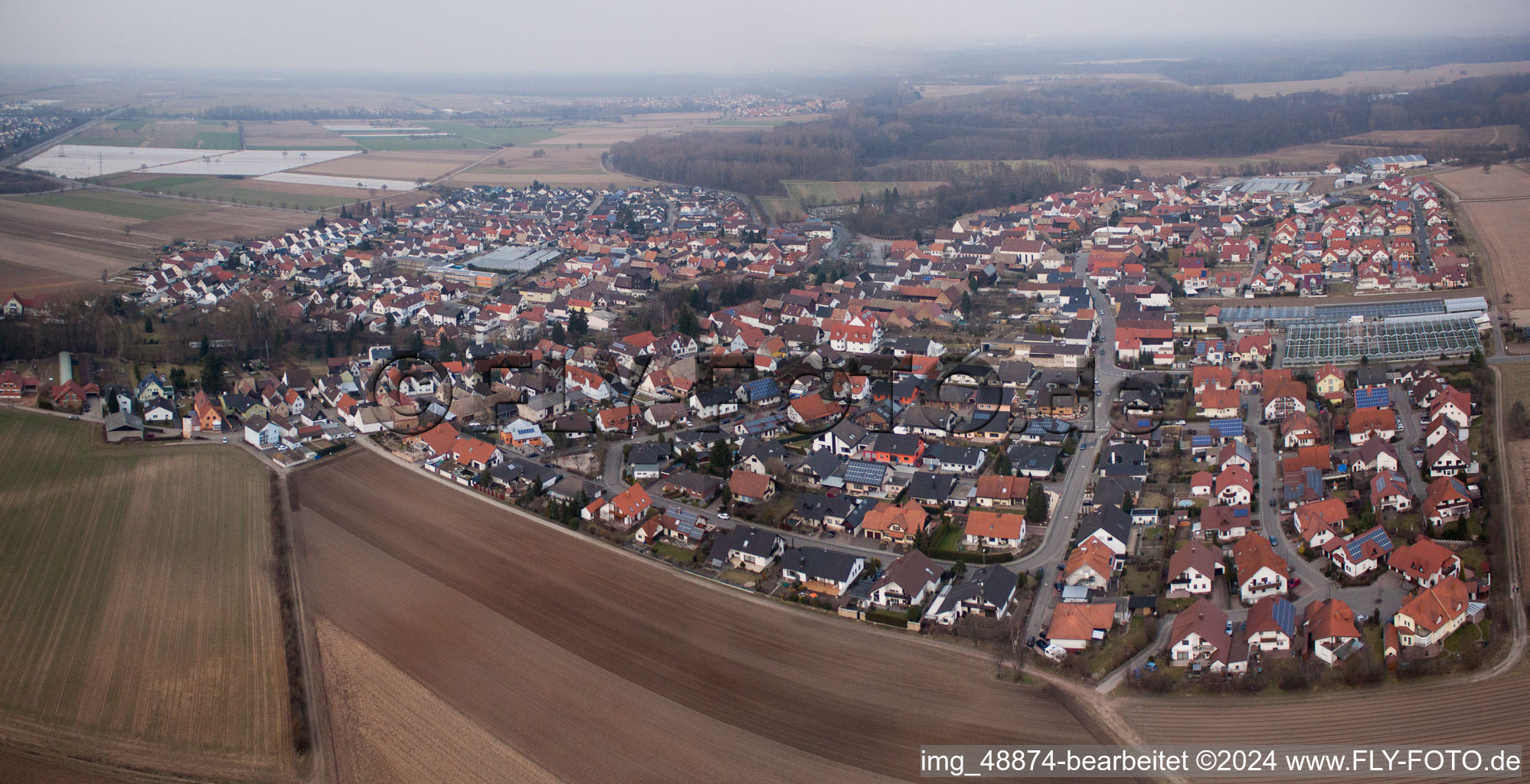 Village - view on the edge of agricultural fields and farmland in Kuhardt in the state Rhineland-Palatinate, Germany from above