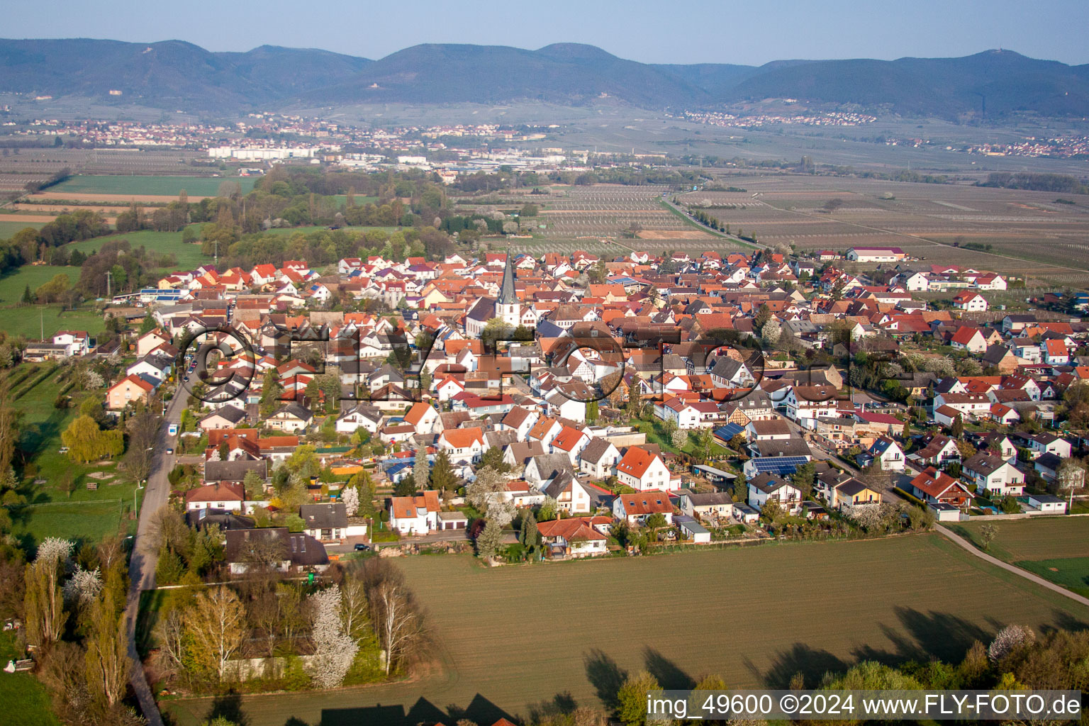 Village - view on the edge of agricultural fields and farmland in Venningen in the state Rhineland-Palatinate, Germany from the plane