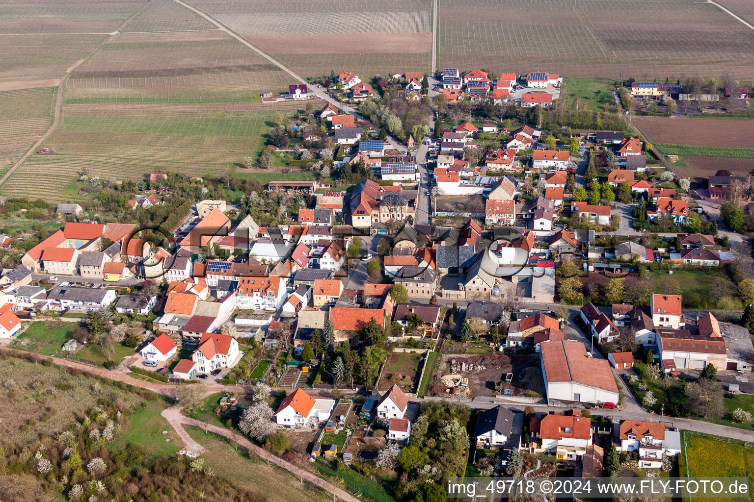 Village - view on the edge of agricultural fields and farmland in Schafhausen in the state Rhineland-Palatinate, Germany