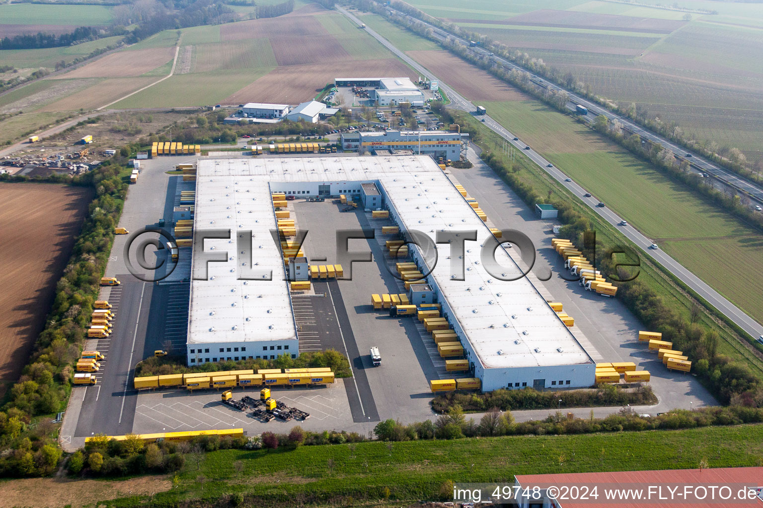 Aerial photograpy of Building complex and grounds of the logistics center of DHL in Saulheim in the state Rhineland-Palatinate, Germany