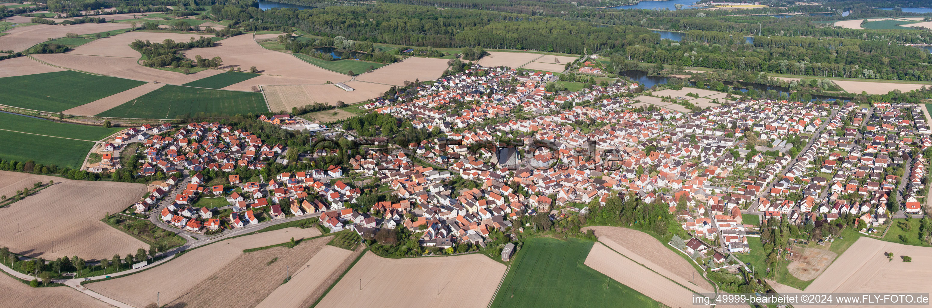 Aerial view of Panoramic perspective Town View of the streets and houses of the residential areas in Leimersheim in the state Rhineland-Palatinate, Germany