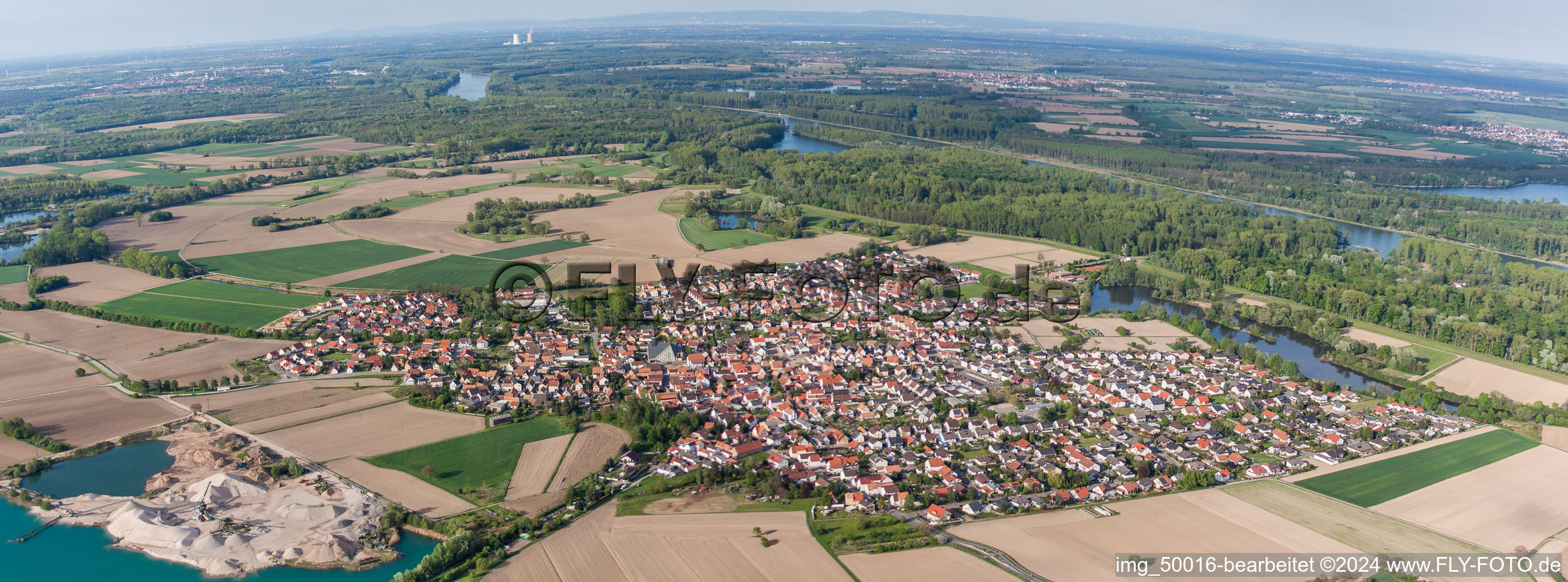 Aerial photograpy of Panoramic perspective Town View of the streets and houses of the residential areas in Leimersheim in the state Rhineland-Palatinate, Germany