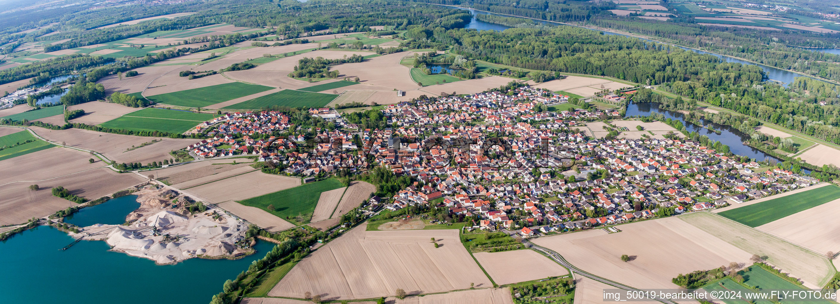 Oblique view of Panoramic perspective Town View of the streets and houses of the residential areas in Leimersheim in the state Rhineland-Palatinate, Germany