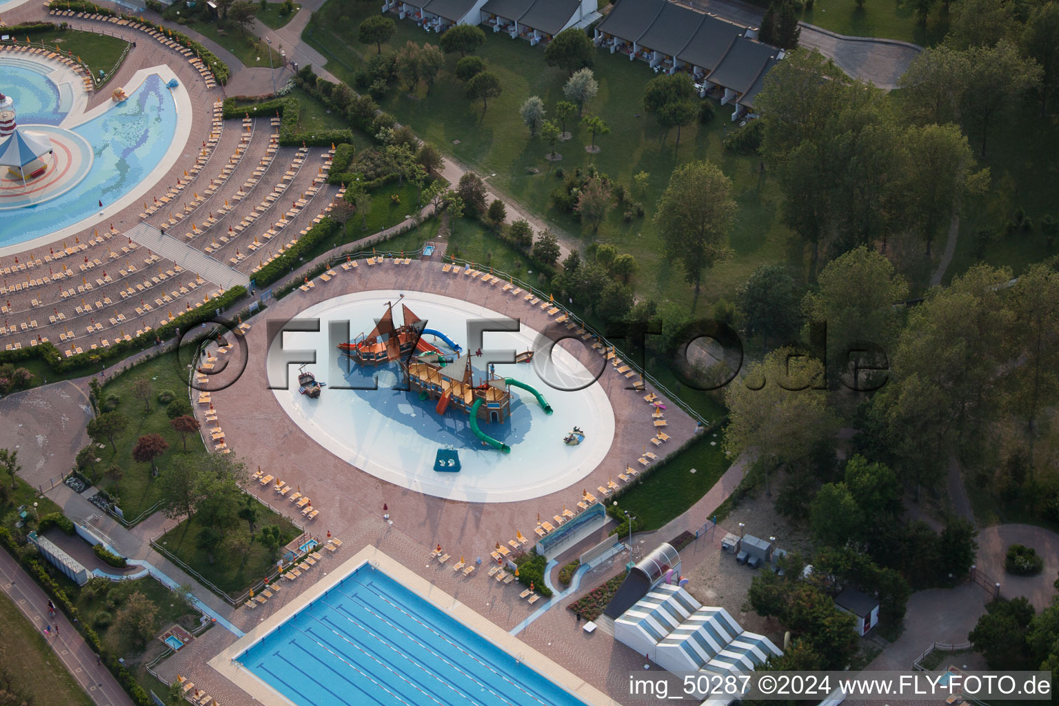 Swimming pool with pirate ship of the Playaloca in Duna Verde in Venetien, Italy