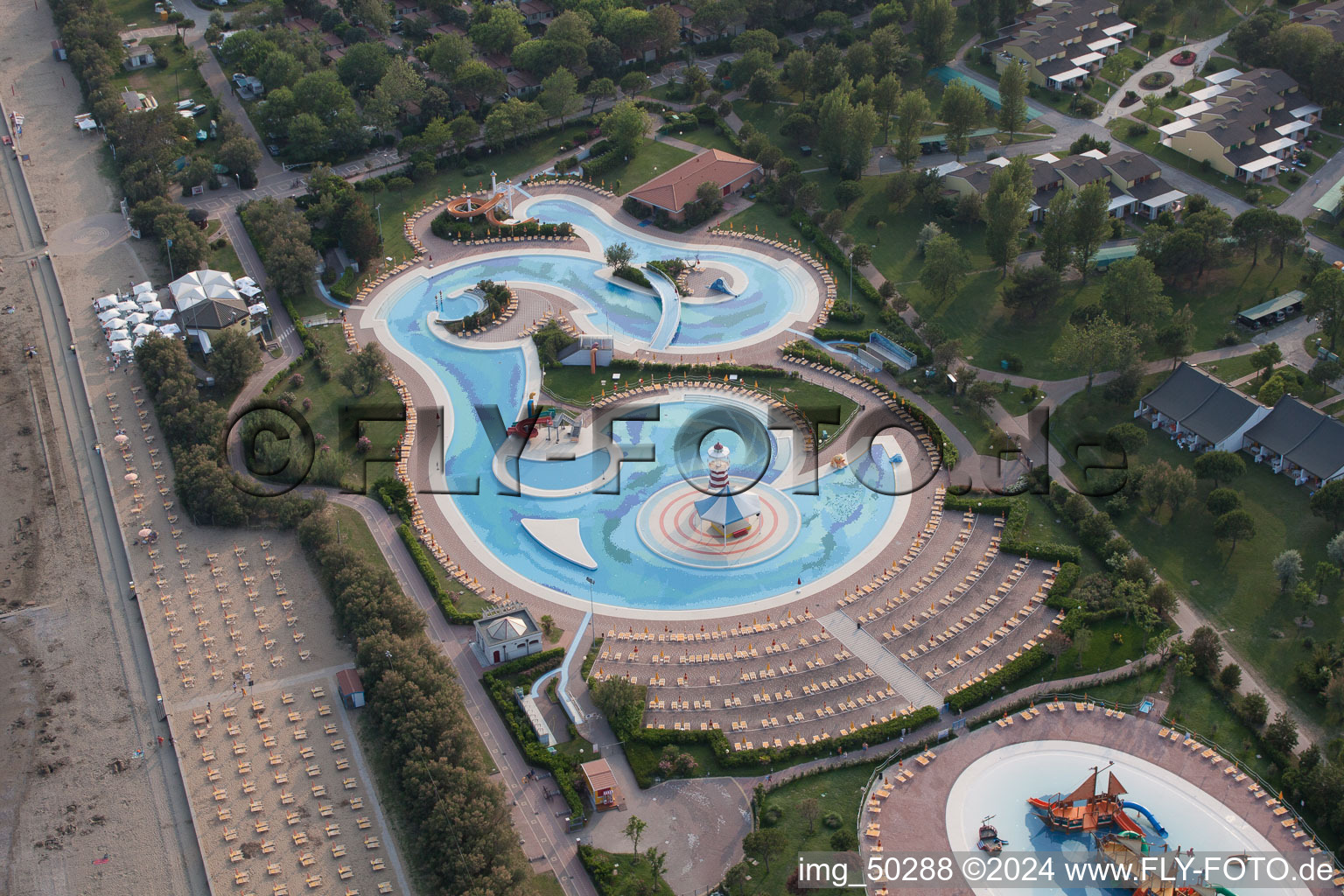 Aerial view of Swimming pool with pirate ship of the Playaloca in Duna Verde in Venetien, Italy