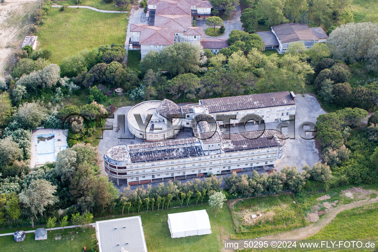 Aerial view of Dilapidated building of ex Colonia La Nostra Famiglia in Duna Verde in Venetien, Italy