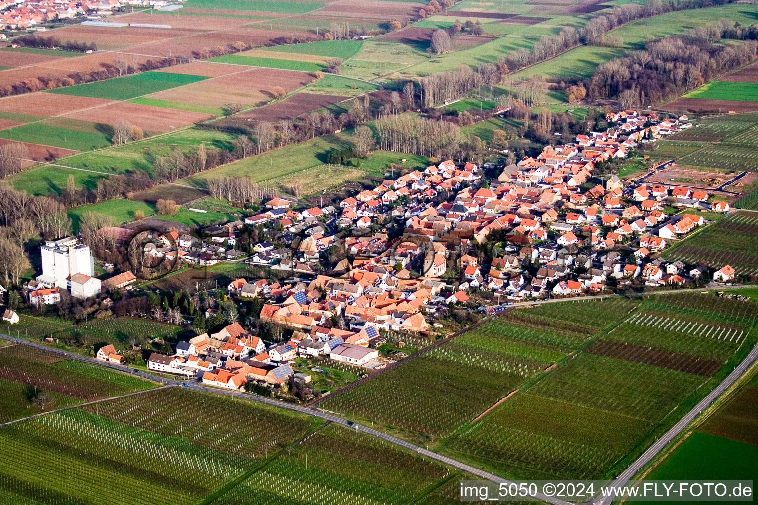 Aerial view of Village - view on the edge of agricultural fields and farmland in Freimersheim (Pfalz) in the state Rhineland-Palatinate