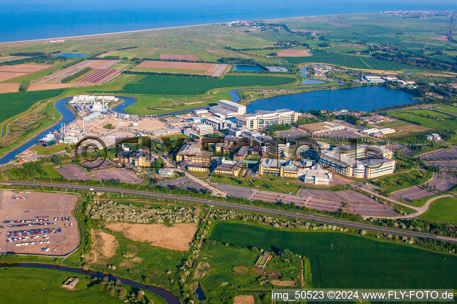 Oblique view of Building and production halls on the premises of the chemical manufacturers Pfizer Ltd and Discovery Park in Sandwich in England, United Kingdom