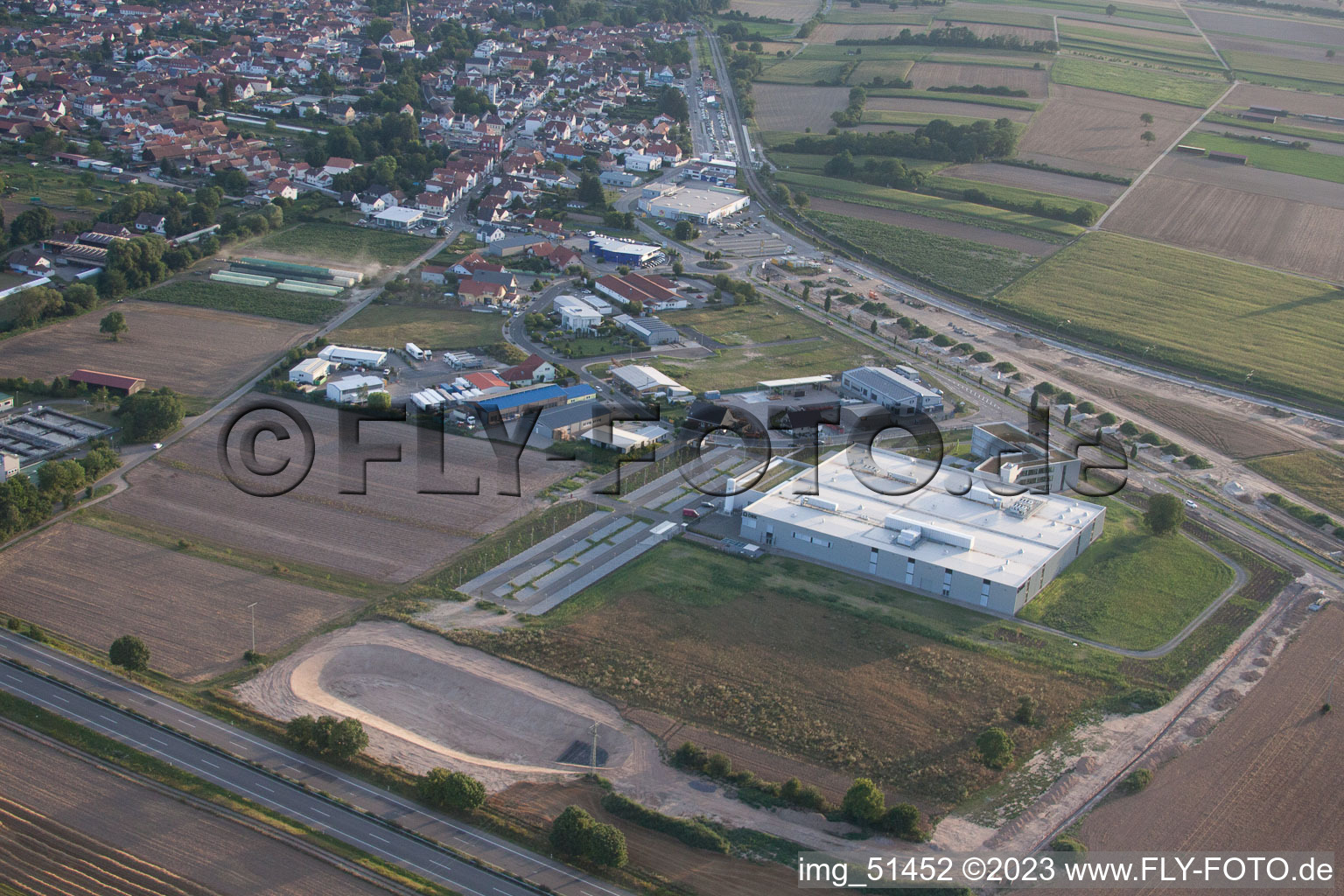 North commercial area, new DBK building in Rülzheim in the state Rhineland-Palatinate, Germany out of the air
