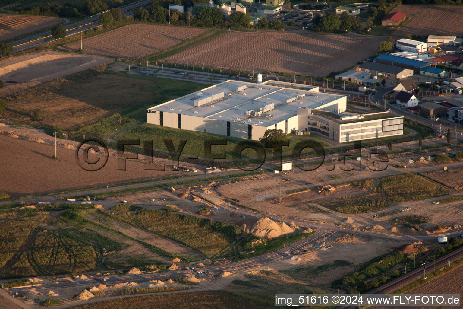 Oblique view of Commercial area north, DBK new building in Rülzheim in the state Rhineland-Palatinate, Germany