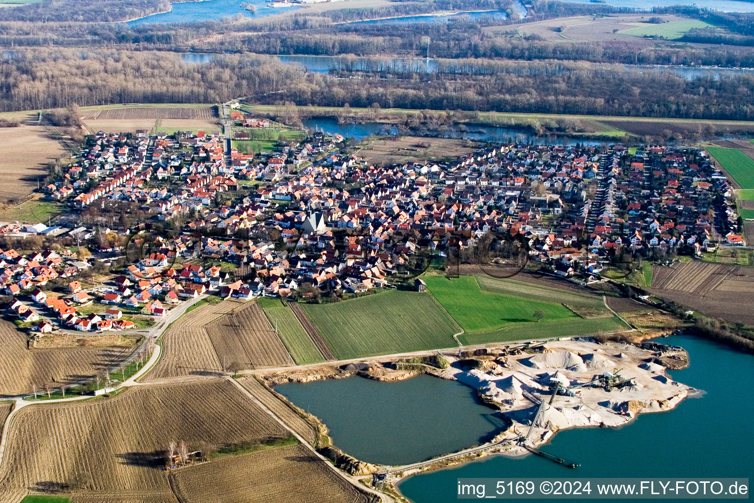 Aerial photograpy of Village - view on the edge of agricultural fields and farmland in Leimersheim in the state Rhineland-Palatinate