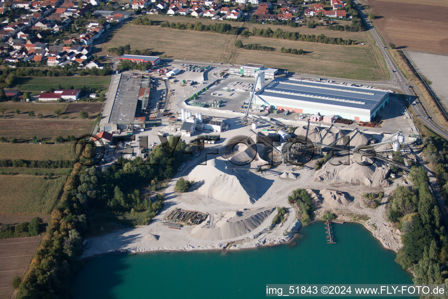 Oblique view of Heidelberger Sand und Kies GmbH - Gravel works Waghäusel in the district Wiesental in Waghäusel in the state Baden-Wuerttemberg, Germany