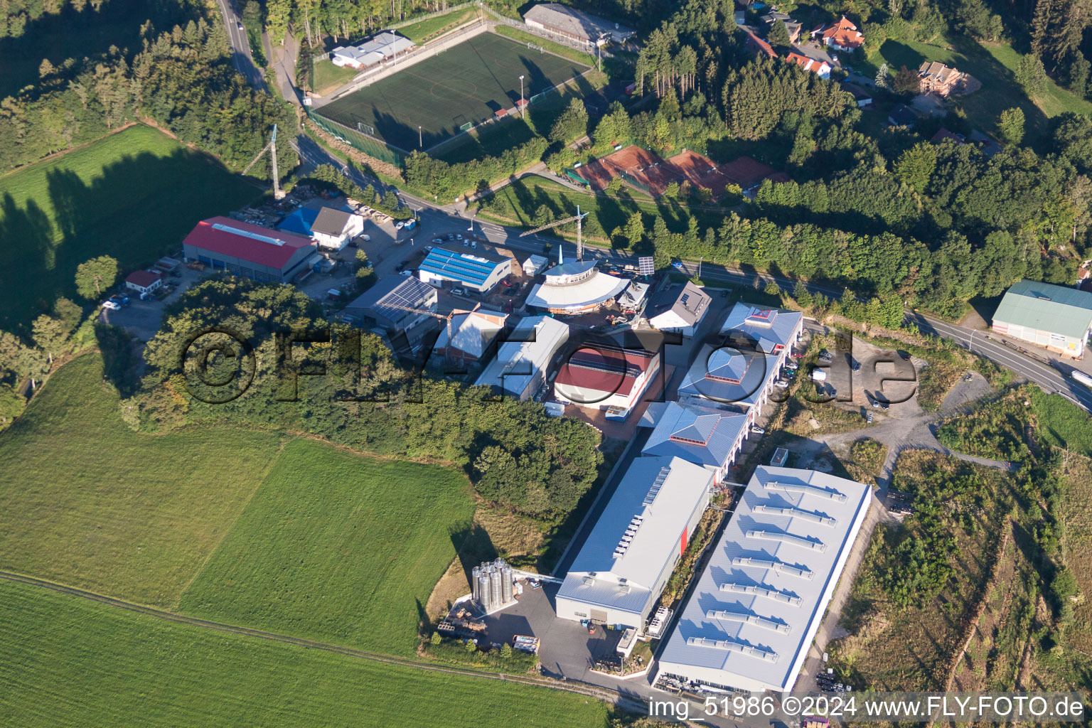 Aerial view of Industrial estate and company settlement with Morton Extrusionstechnik GmbH zu Fuessen des Sendemast in Abtsteinach in the state Hesse, Germany