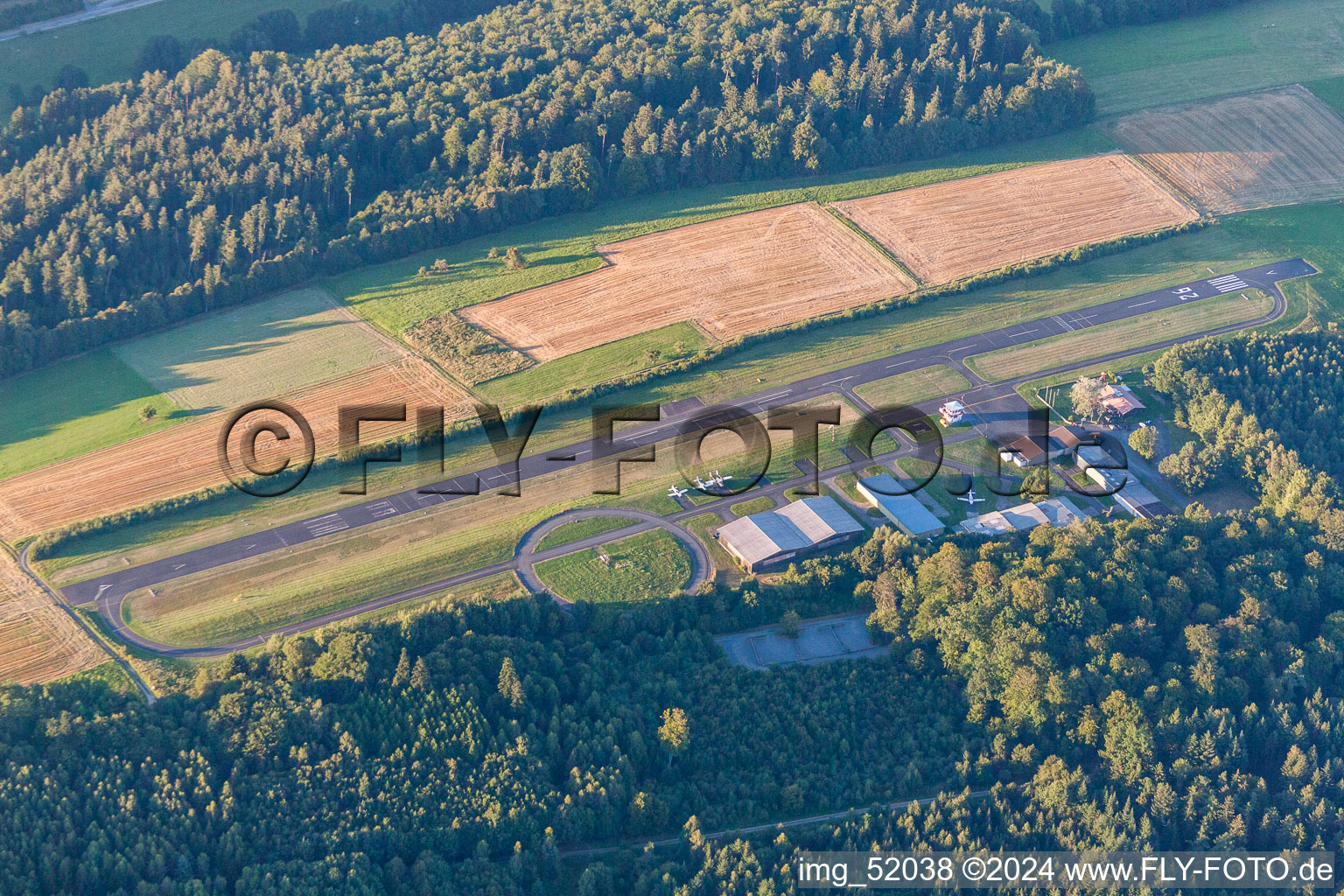 Runway with tarmac terrain of airfield Aero-Club Odenwald e.V. in Michelstadt in the state Hesse, Germany