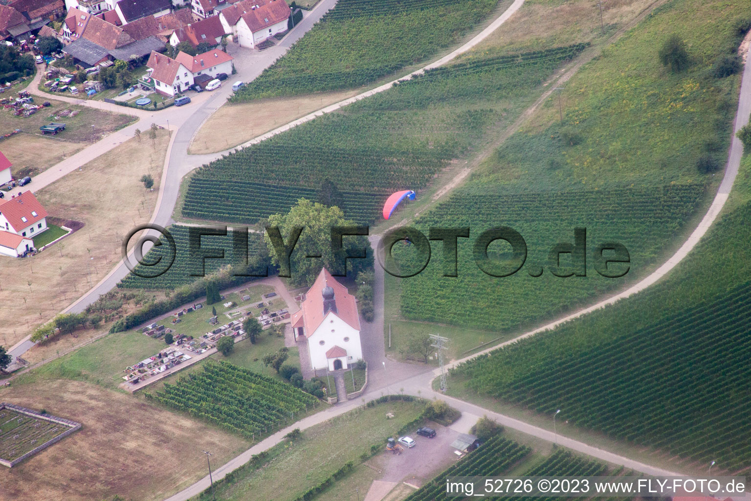 St. Dionysius Chapel with paraglider in the district Gleiszellen in Gleiszellen-Gleishorbach in the state Rhineland-Palatinate, Germany