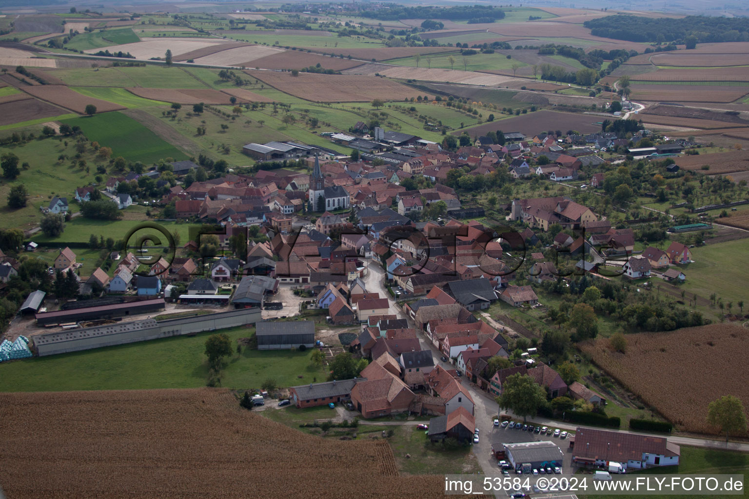 Village - view on the edge of agricultural fields and farmland in Ingenheim in Grand Est, France