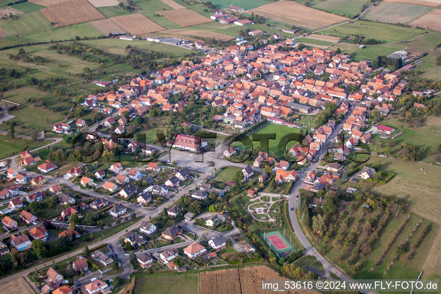 Aerial photograpy of Village - view on the edge of agricultural fields and farmland in Uhrwiller in Grand Est, France