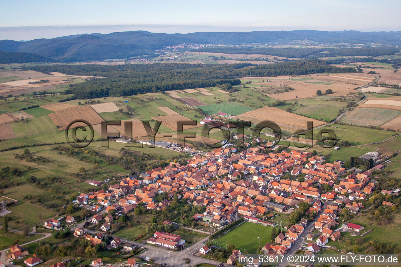 Oblique view of Village - view on the edge of agricultural fields and farmland in Uhrwiller in Grand Est, France