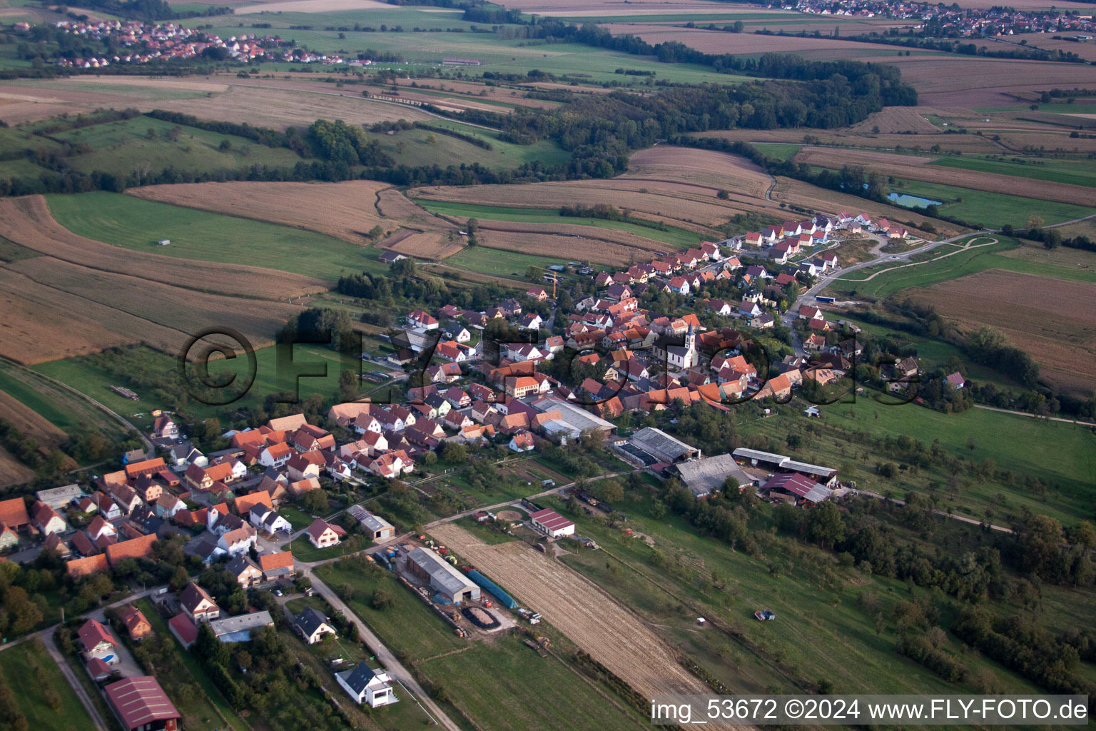 Aerial view of Village - view on the edge of agricultural fields and farmland in Forstheim in Grand Est, France