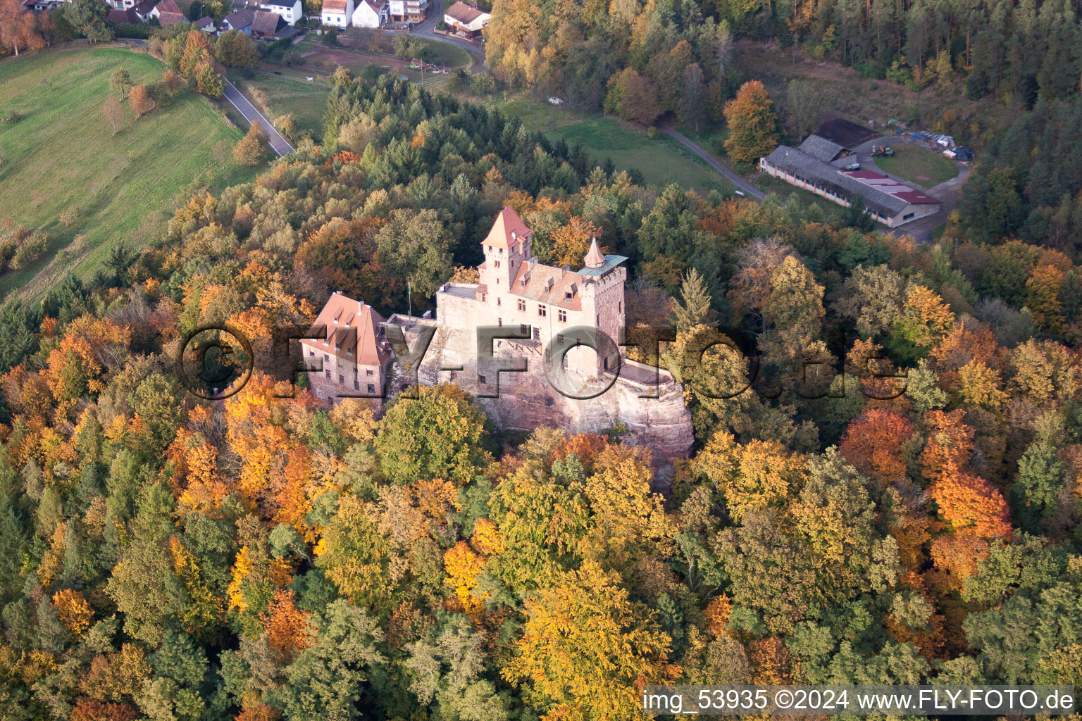 Aerial view of Ruins and vestiges of the former castle and fortress Burg Berwartstein in autumn colured forest in Erlenbach bei Dahn in the state Rhineland-Palatinate