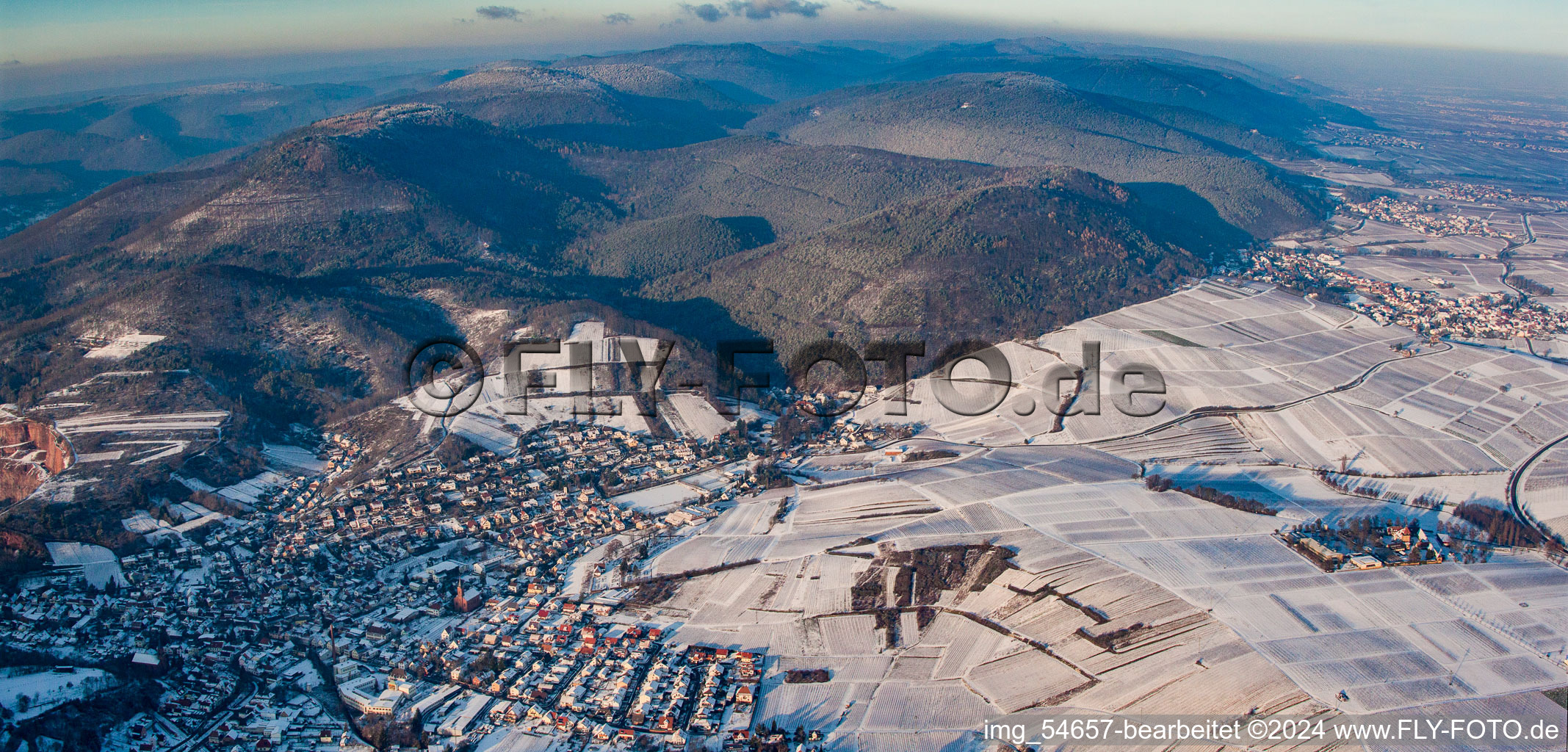 Winterly Town View of the streets and houses of the residential areas in Albersweiler in the state Rhineland-Palatinate from the plane