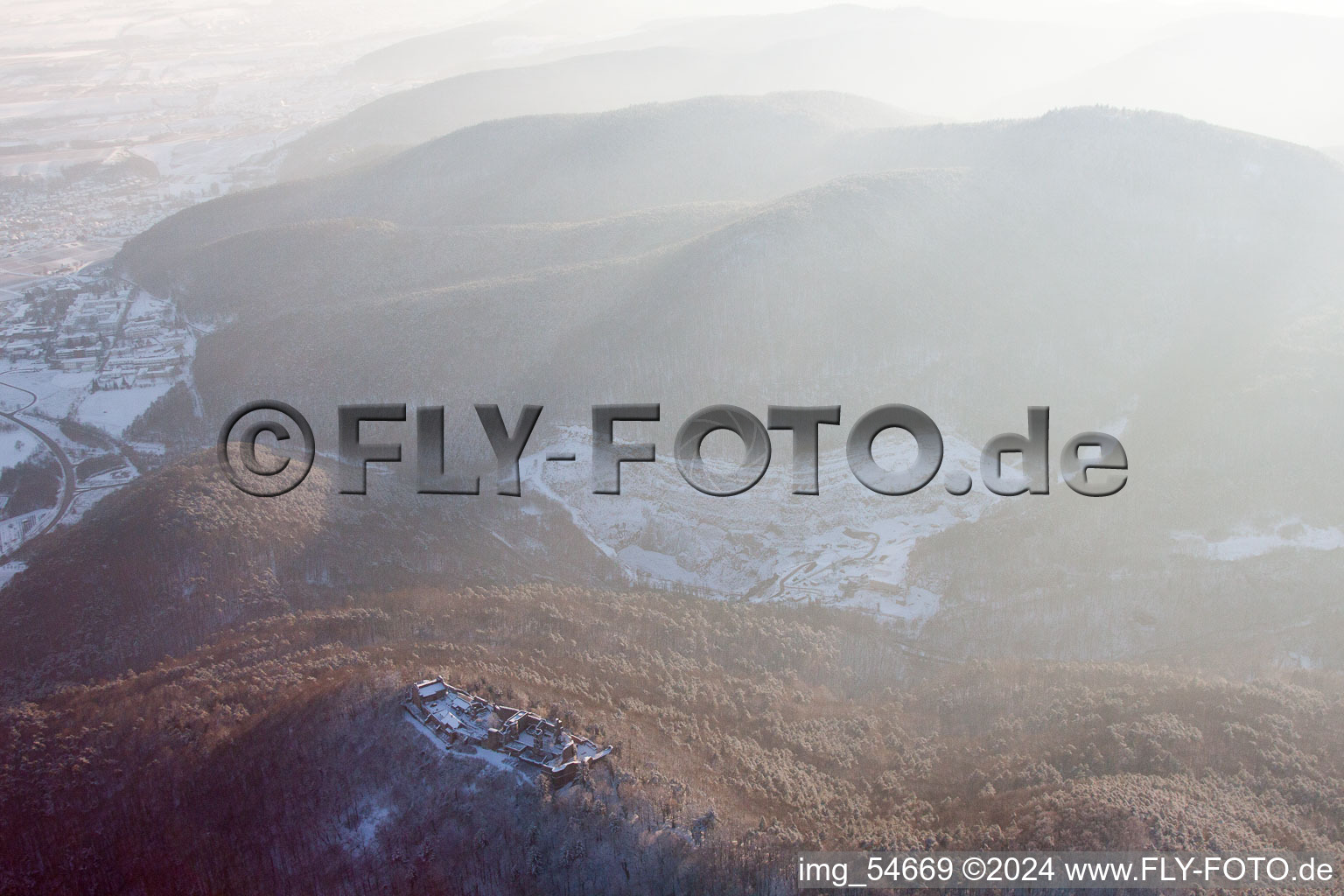 Aerial view of Madenburg castle ruins in winter with snow in Eschbach in the state Rhineland-Palatinate, Germany