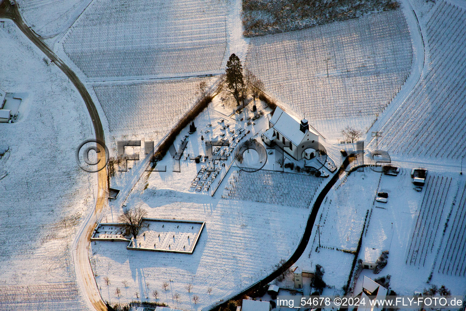 Wintry snowy churche building of the chapel St. Dionysius in Gleiszellen-Gleishorbach in the state Rhineland-Palatinate