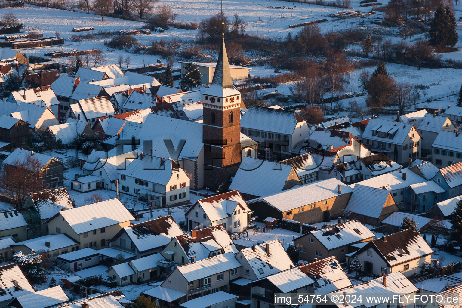 Wintry snowy Church building in the village of in the district Schaidt in Woerth am Rhein in the state Rhineland-Palatinate, Germany