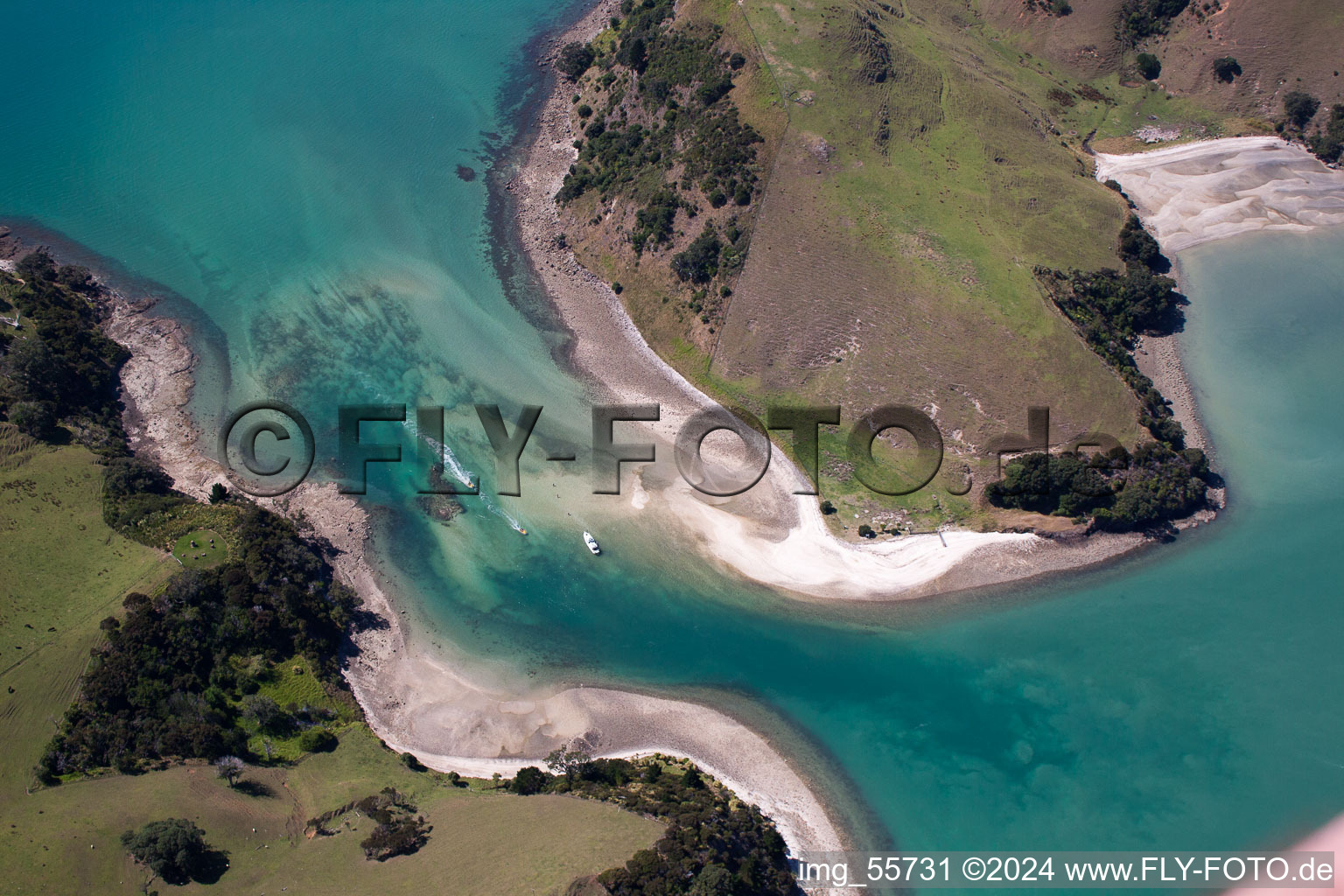 Water surface at the seaside between twi islands in the Mcgregor Bay in Wyuna Bay in Waikato, New Zealand