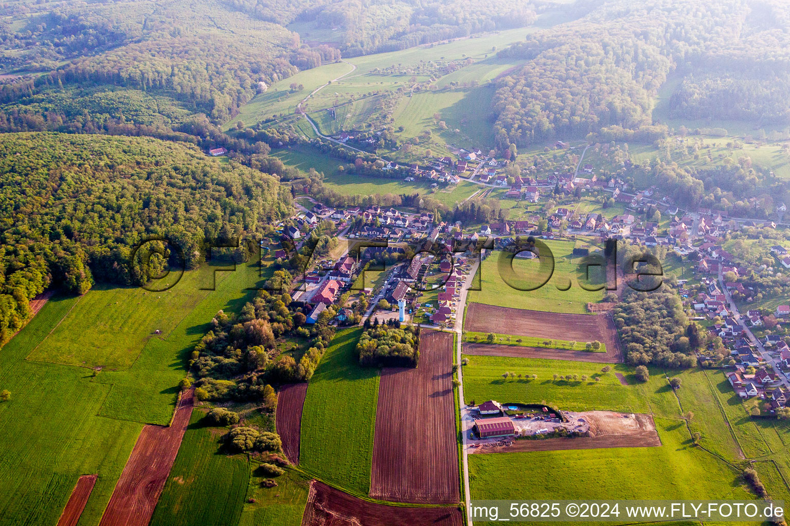 Village - view on the edge of agricultural fields and farmland in Langensoultzbach in Grand Est, France