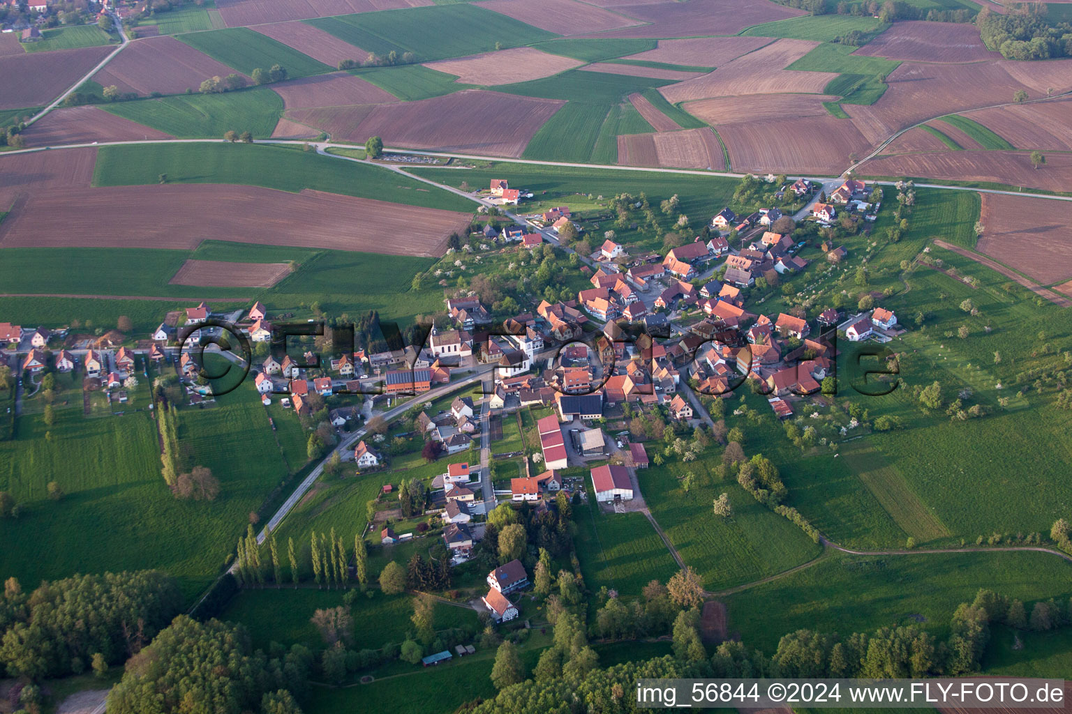 Village - view on the edge of agricultural fields and farmland in Keffenach in Grand Est, France