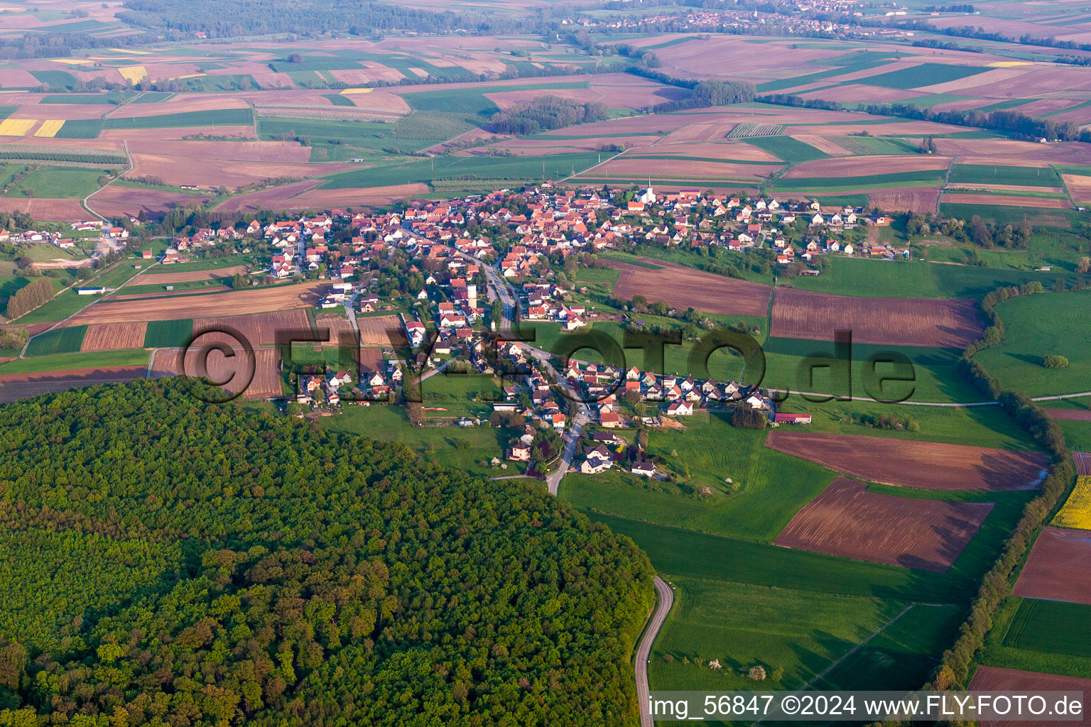 Village - view on the edge of agricultural fields and farmland in Schoenenbourg in Grand Est, France from above