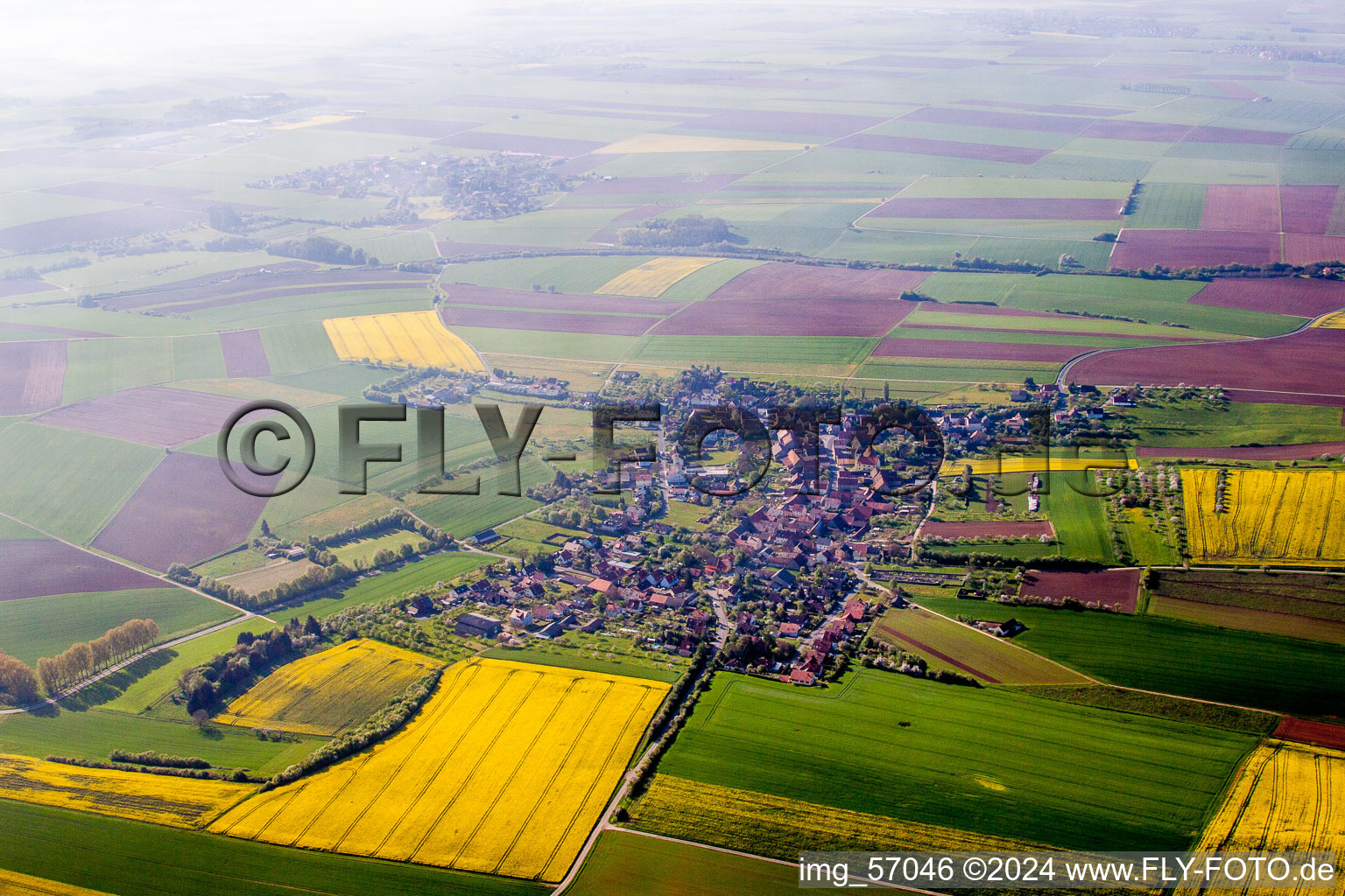 Village - view on the edge of agricultural fields and farmland in Uengershausen in the state Bavaria, Germany