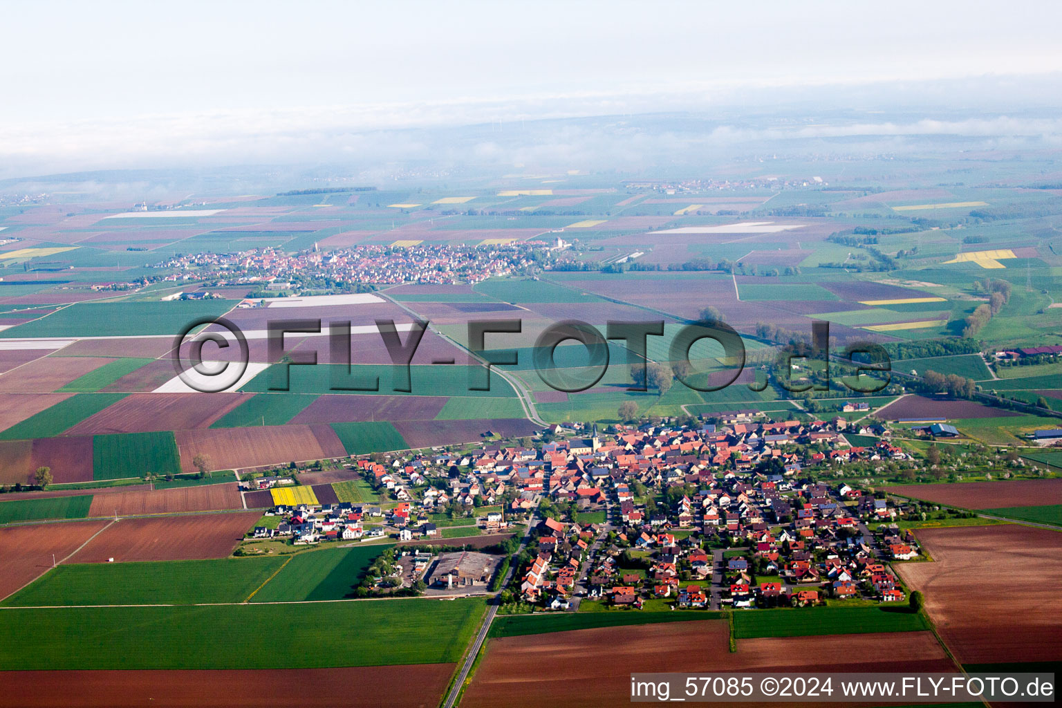 Village - view on the edge of agricultural fields and farmland in Oberpleichfeld in the state Bavaria, Germany