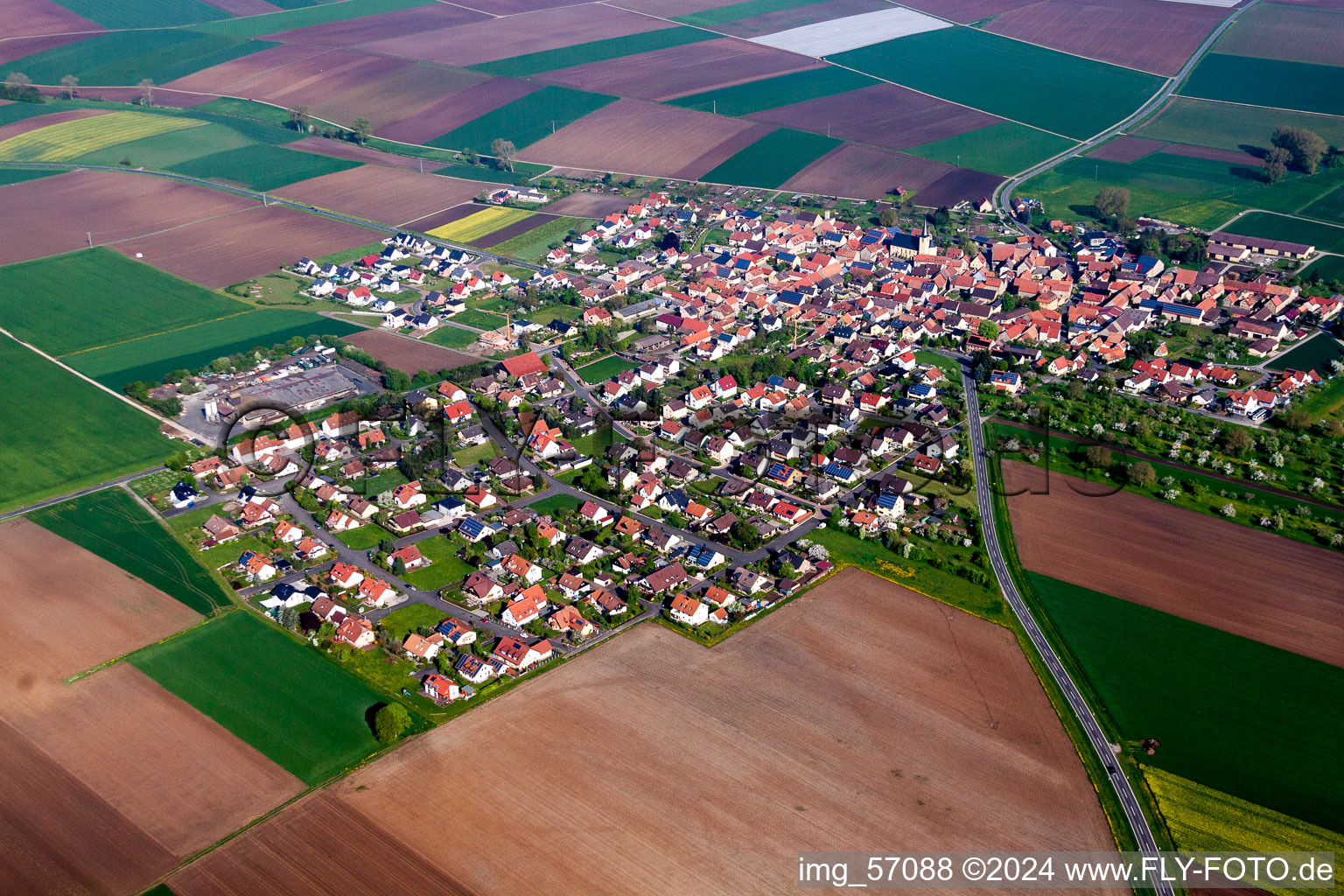 Aerial view of Village - view on the edge of agricultural fields and farmland in Oberpleichfeld in the state Bavaria, Germany