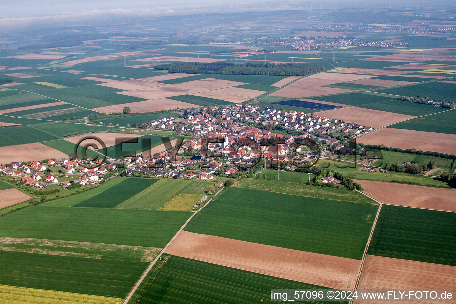 Village - view on the edge of agricultural fields and farmland in Theilheim in the state Bavaria, Germany