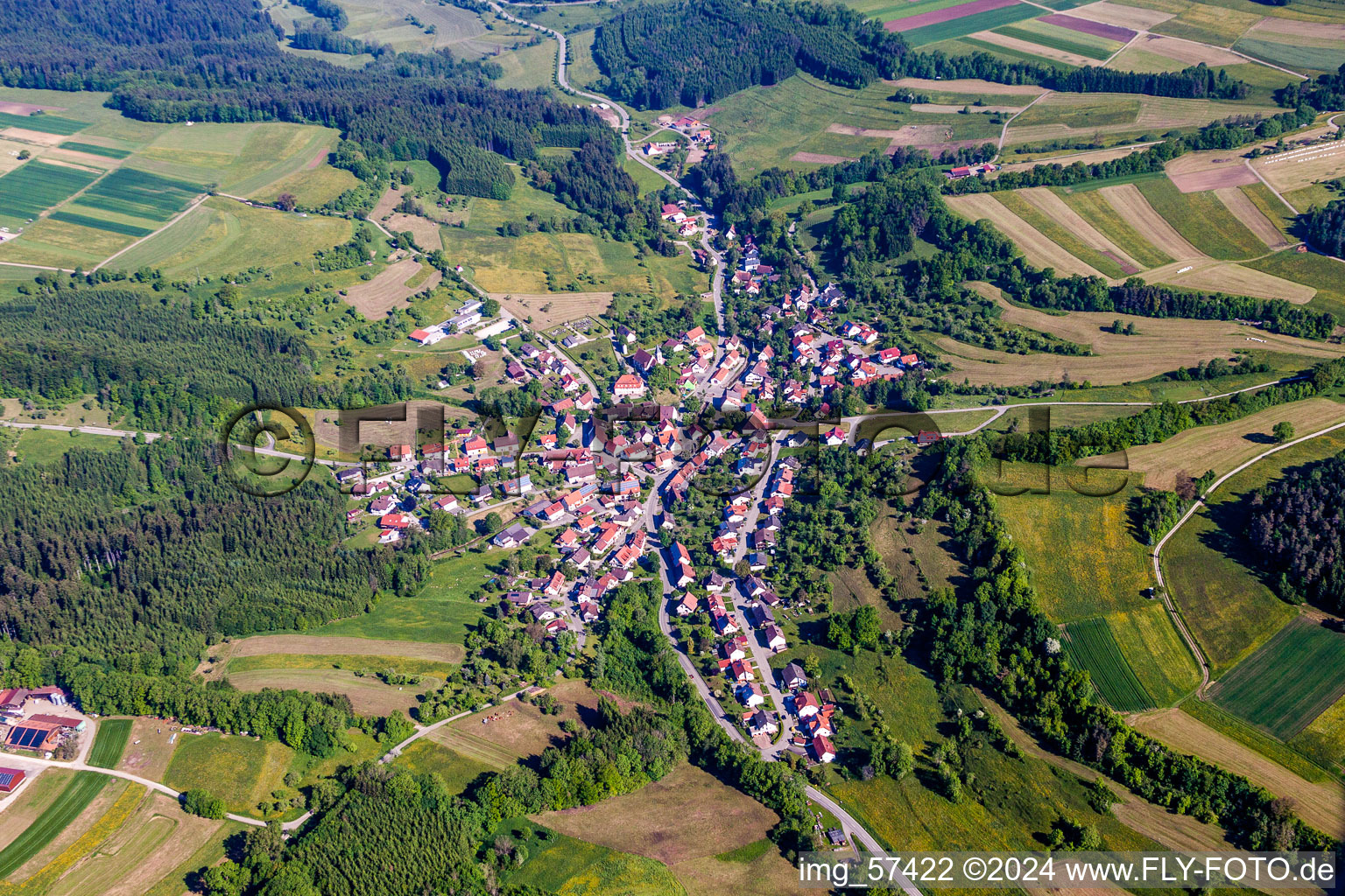 Aerial view of Village - view on the edge of agricultural fields and farmland in Zimmern unter der Burg in the state Baden-Wurttemberg, Germany