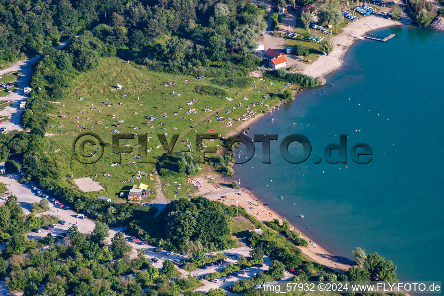 Mass influx of nudist bathers on the beach and the shore areas of the lake Epplesee in Rheinstetten in the state Baden-Wurttemberg, Germany