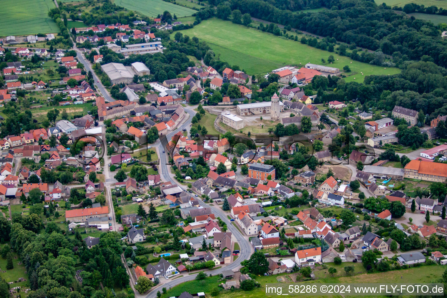 Village - view on the edge of agricultural fields and farmland in Hausneindorf in the state Saxony-Anhalt, Germany