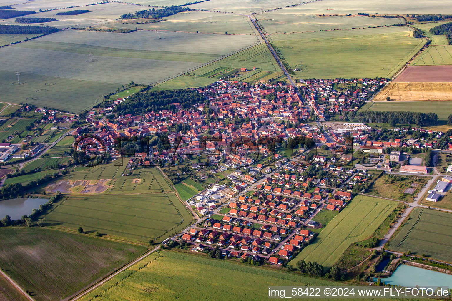 Village - view on the edge of agricultural fields and farmland in Harsleben in the state Saxony-Anhalt, Germany