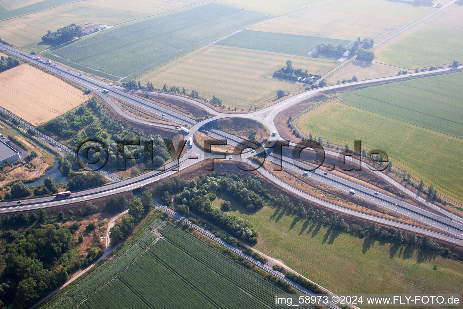 Routing and traffic lanes during the highway exit and access the motorway E40 to channel ferry port Dunkerque in Craywick in Hauts-de-France, France