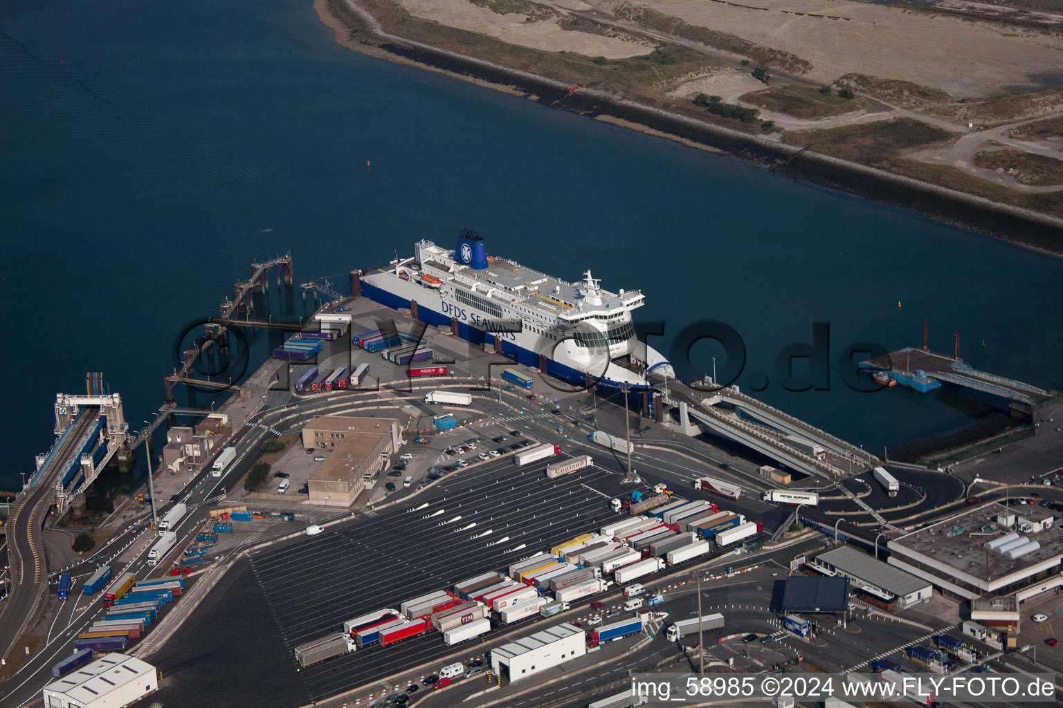 Aerial view of Ferry at the Port on the seashore of the Channel-ferry port Dunkerque in Loon-Plage in Hauts-de-France, France