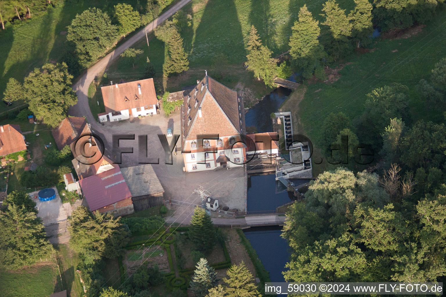 Historic watermill on a farm homestead in the district Bienwaldmuehle in Scheibenhardt in the state Rhineland-Palatinate