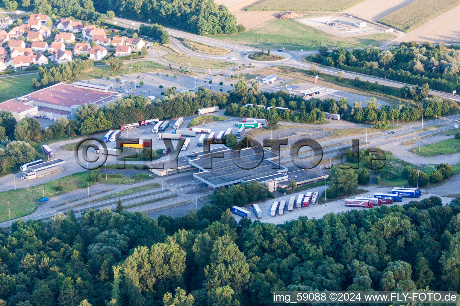 Aerial view of Lorries and Truck storage areas and free-standing storage on former customs Lauterbourg now state-police department Bienwald in Scheibenhard in Grand Est, France